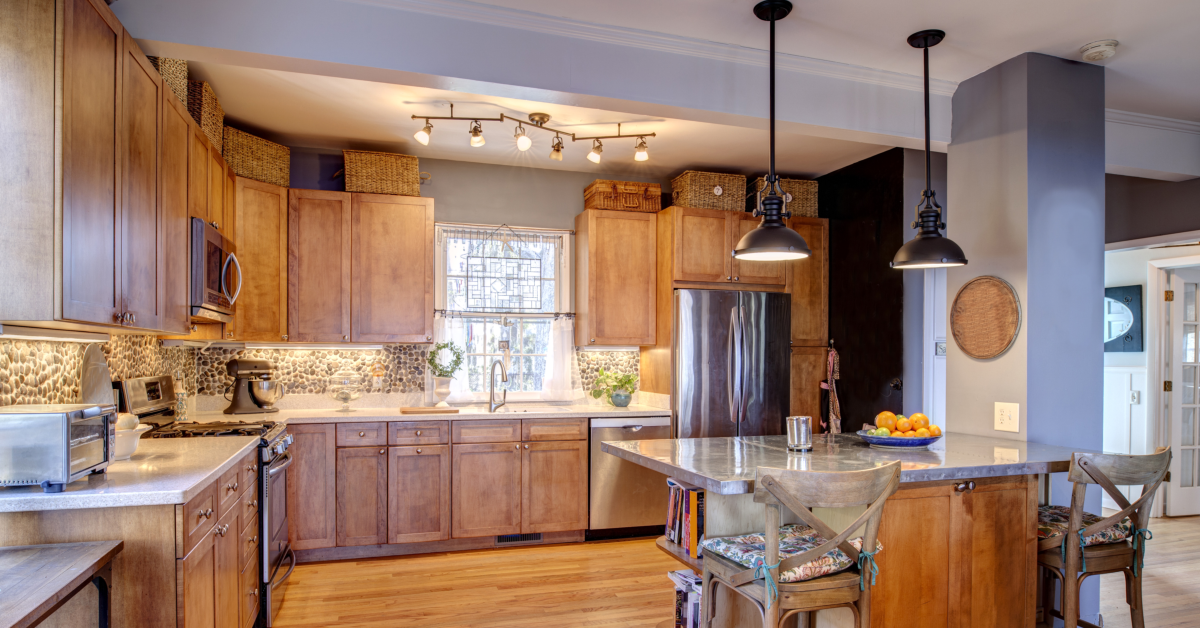 Large kitchen with home lighting including task lights, accent lights, and ambient lighting.