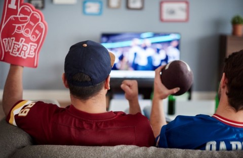 Men watching football in man cave